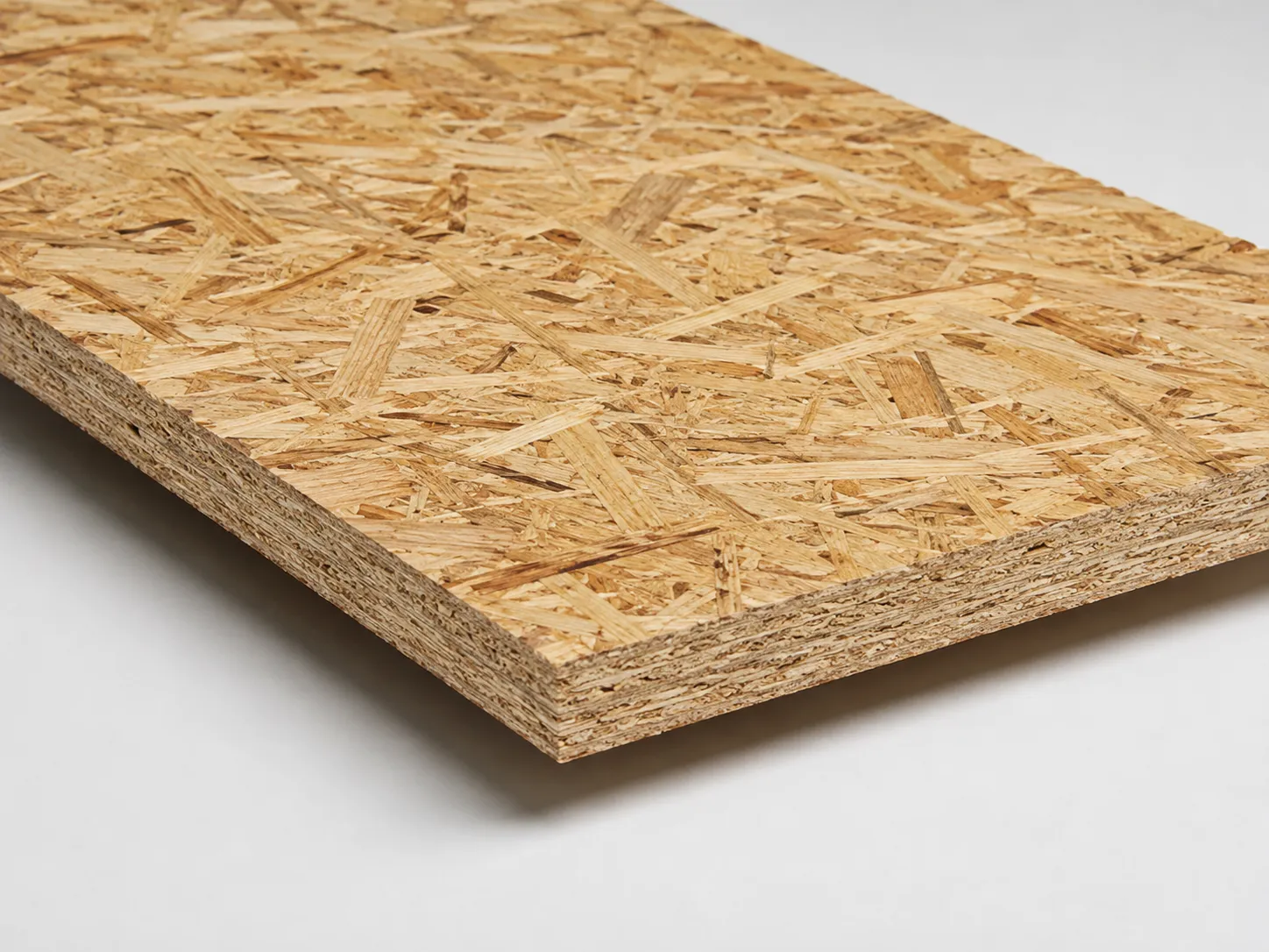 OSB panel showing oriented wood strand surface and layered edge structure